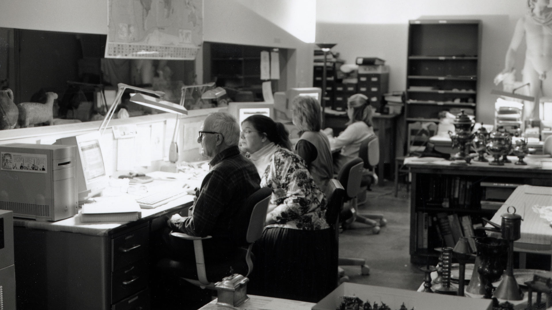 Black and white photo of staff working in gallery of Lincoln Hall ca. 1998