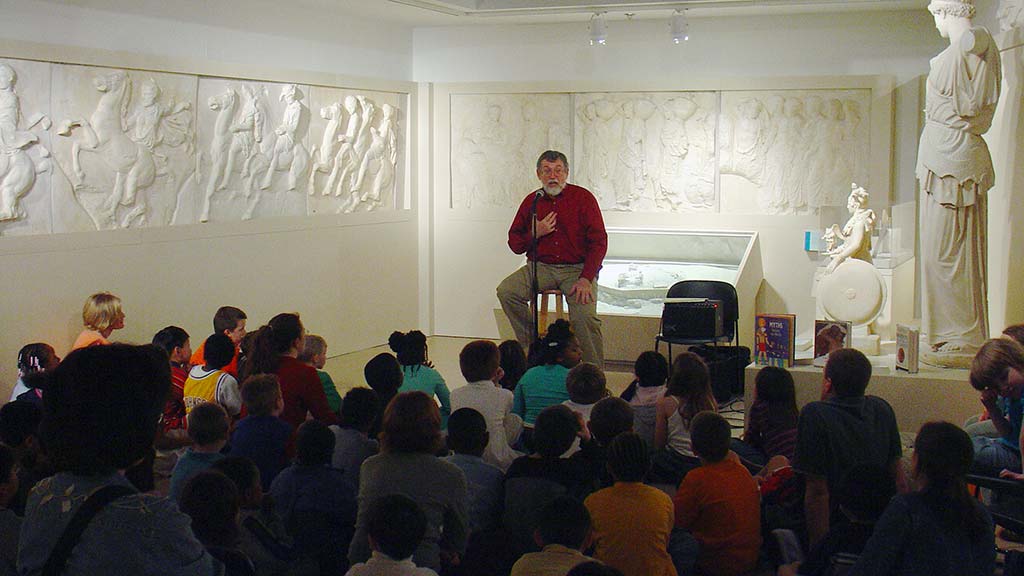 Storyteller performing to childen in Ancient Mediterranean Gallery