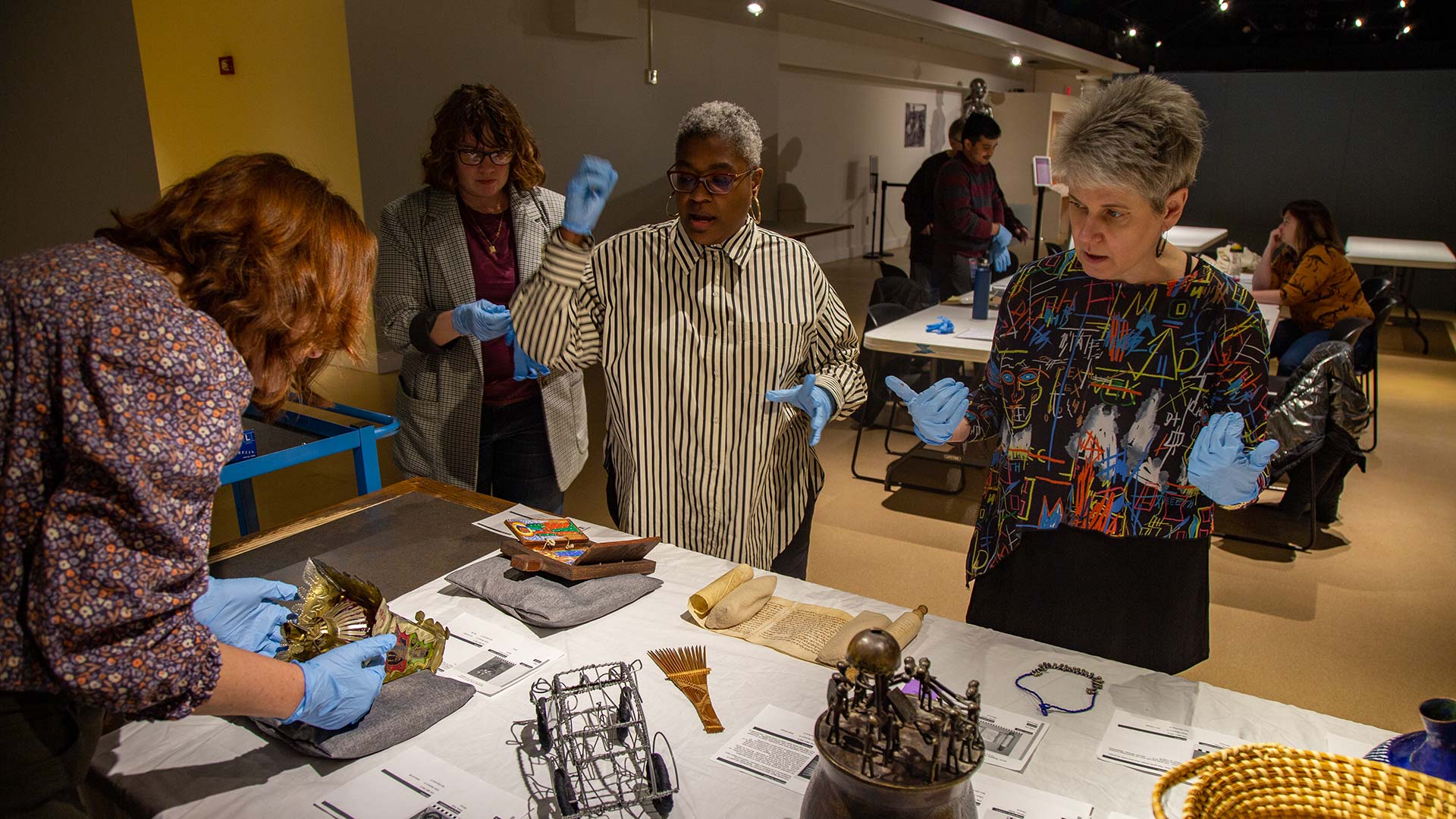 Museum staff reviewing Oceanic artifacts