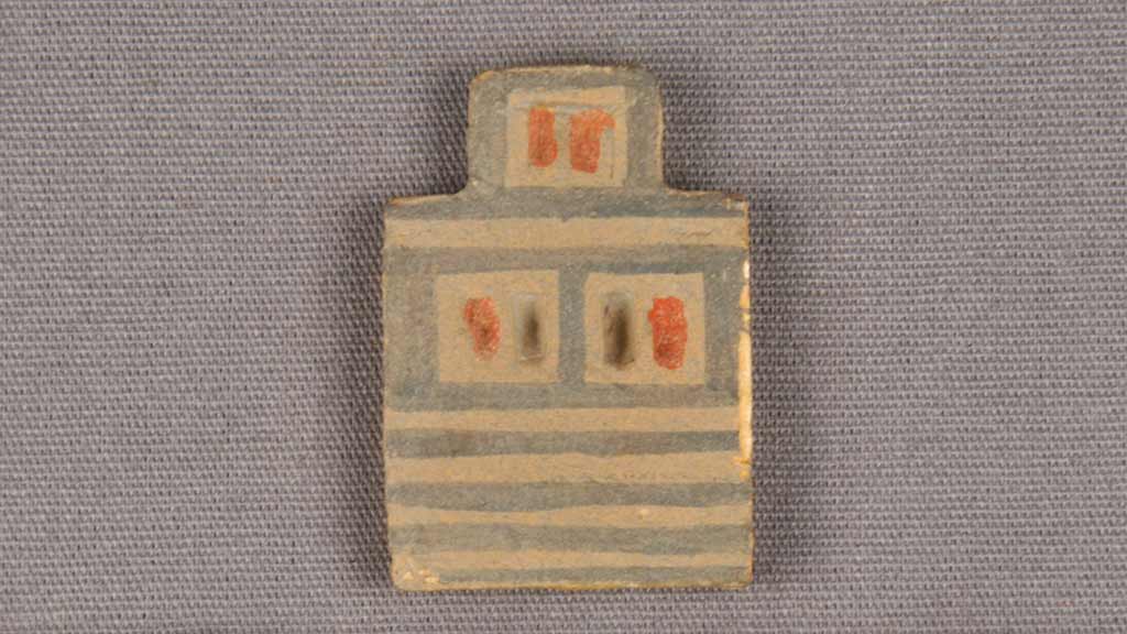 tiny depiction of a grey and red striped house wall