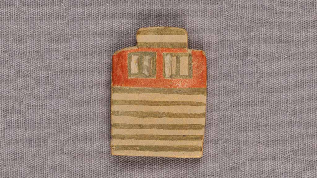 tiny depiction of a striped house wall with two windows