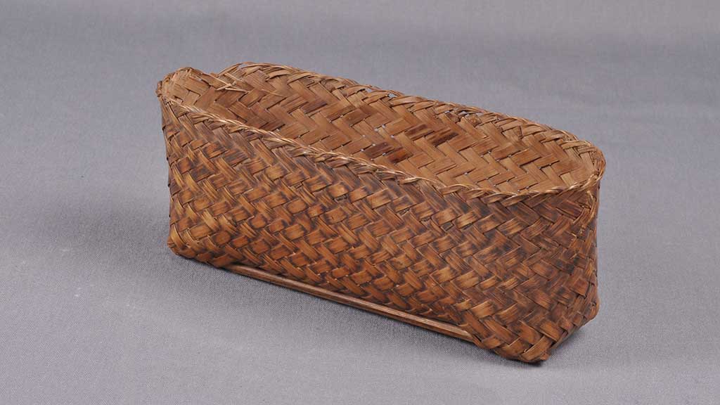 long and skinny tightly woven rigid basket