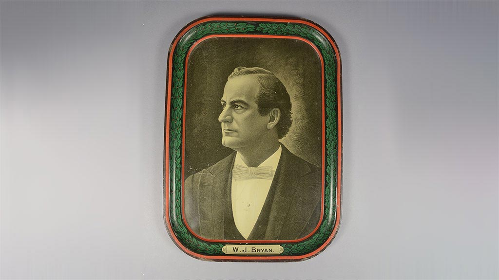 vintage tray featuring a sepia-toned portrait of middle aged-man in suit, labeled W. J. Bryan