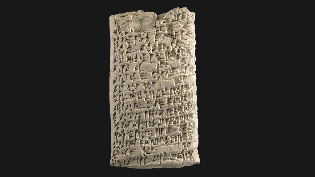 rectangular tablet with densely packed cuneiform across the surface