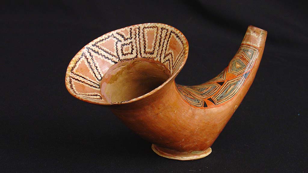 conical ceramic vessel with geometric designs