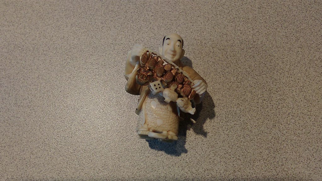 a figurine of a merchant