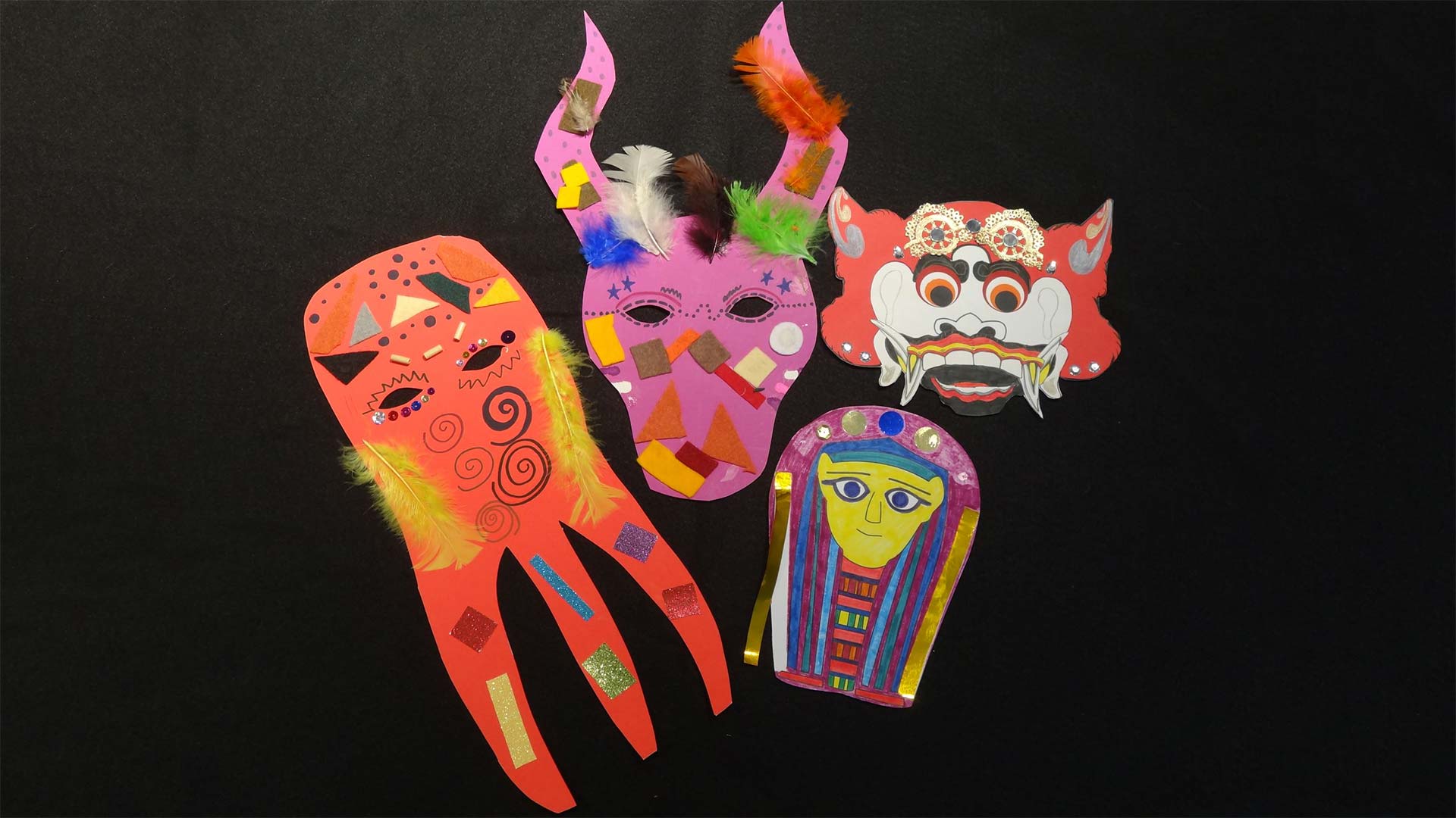 Multicolored paper masks from around the work with embellishments