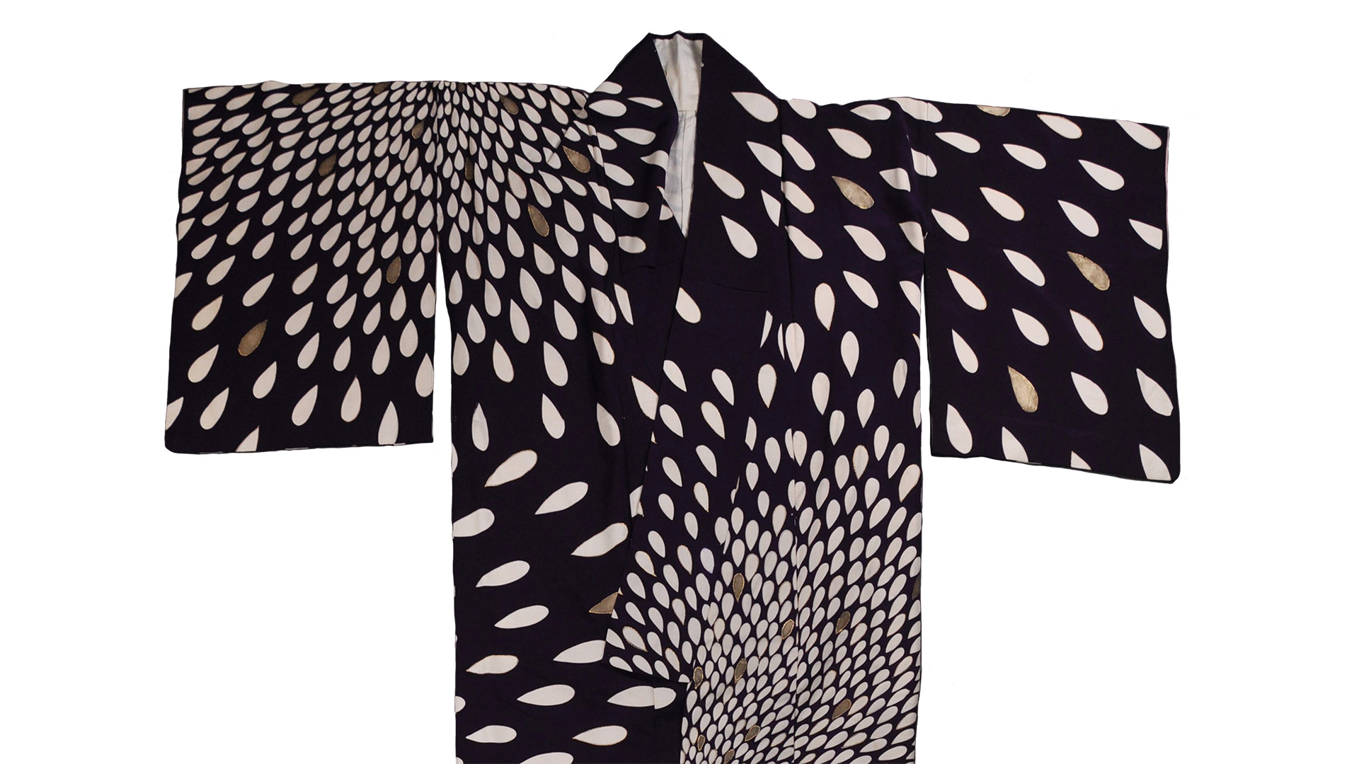 Japanese traditional clothing Kimono, black in color, populated with cream colored petals 