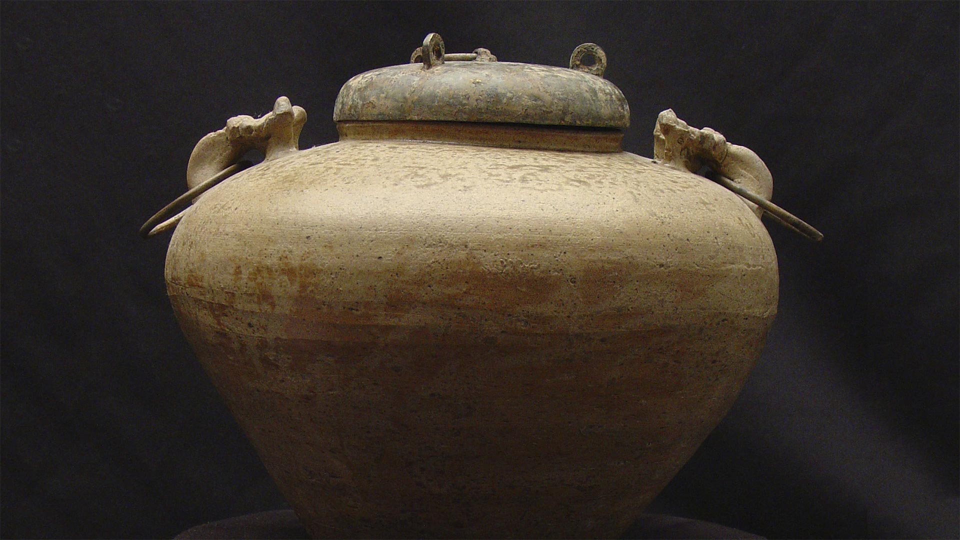 large unglazed ceramic vessel with lid