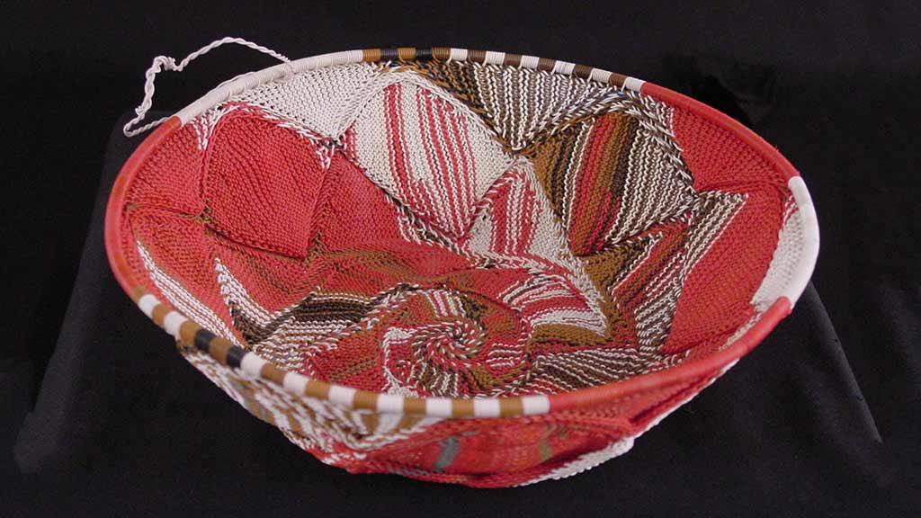 bowl-shaped tightly woven red and white basket