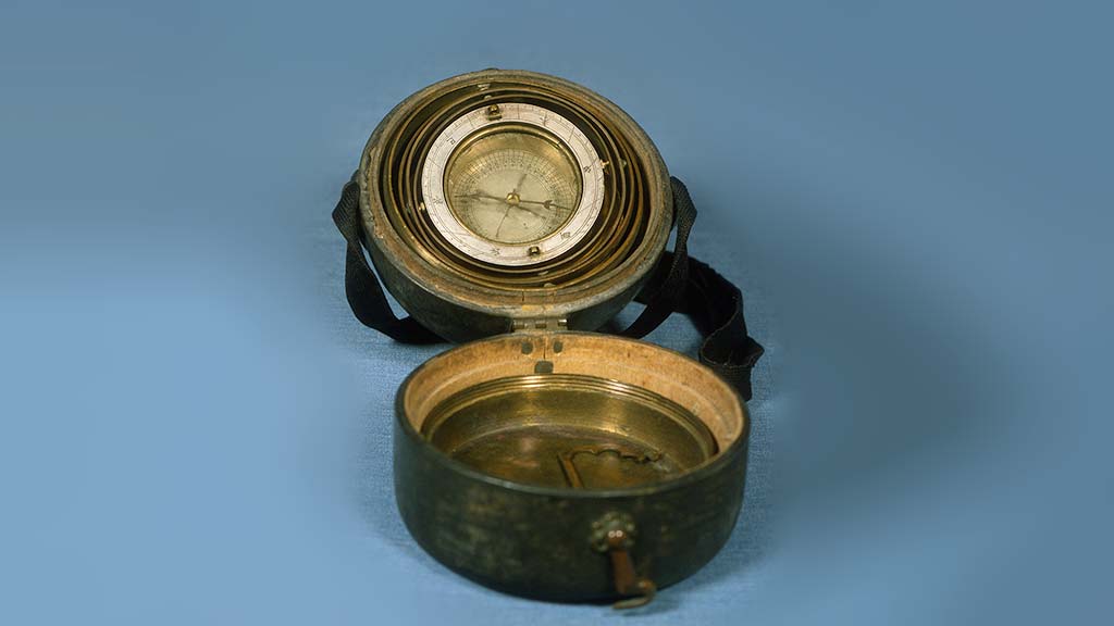 compass with a flipped open lid