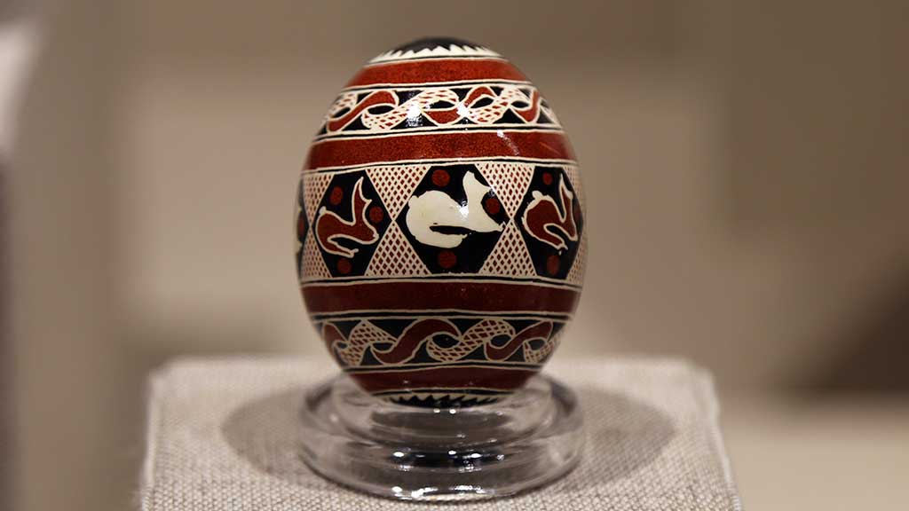 decorated egg with brown, black, and white abstract designs