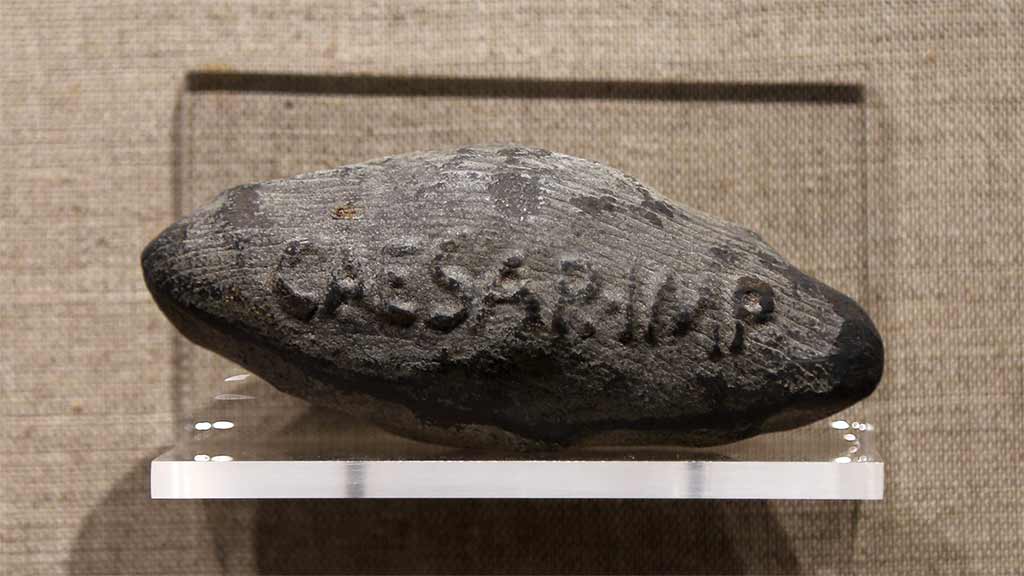 rough diamond shaped bullet that says 'caesar-imp'
