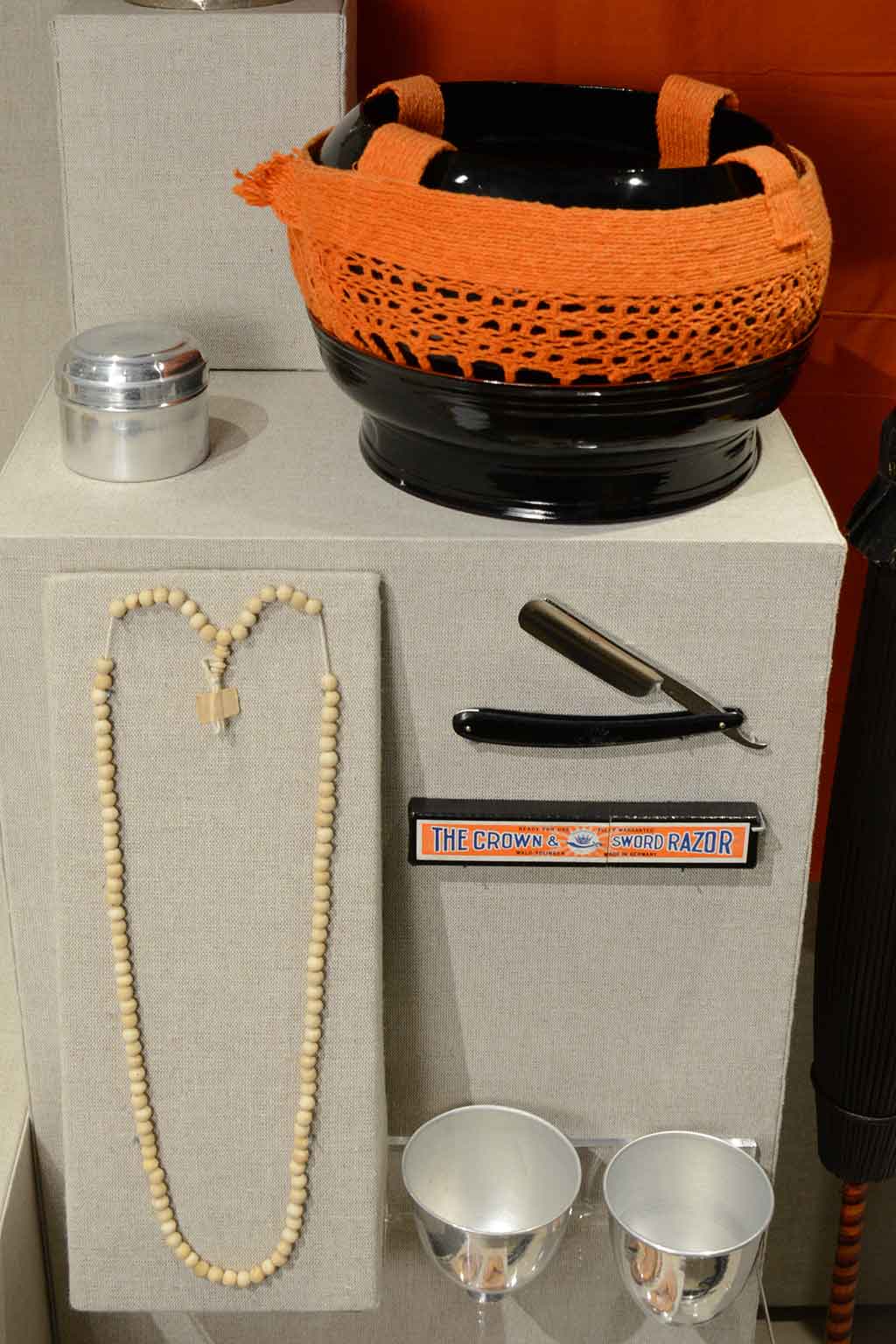 beads, a razor, and various containers on exhibit