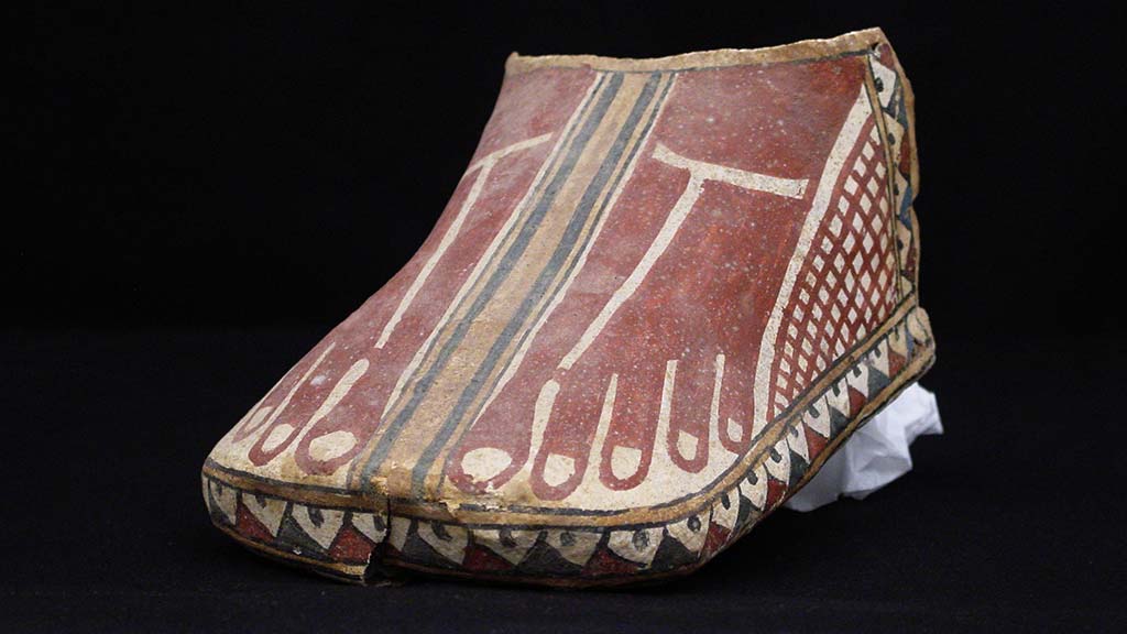 foot-shaped object with bare feet painted on it
