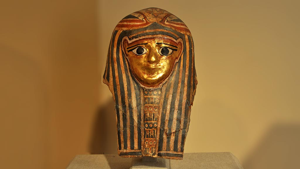 decorated mask with gold face