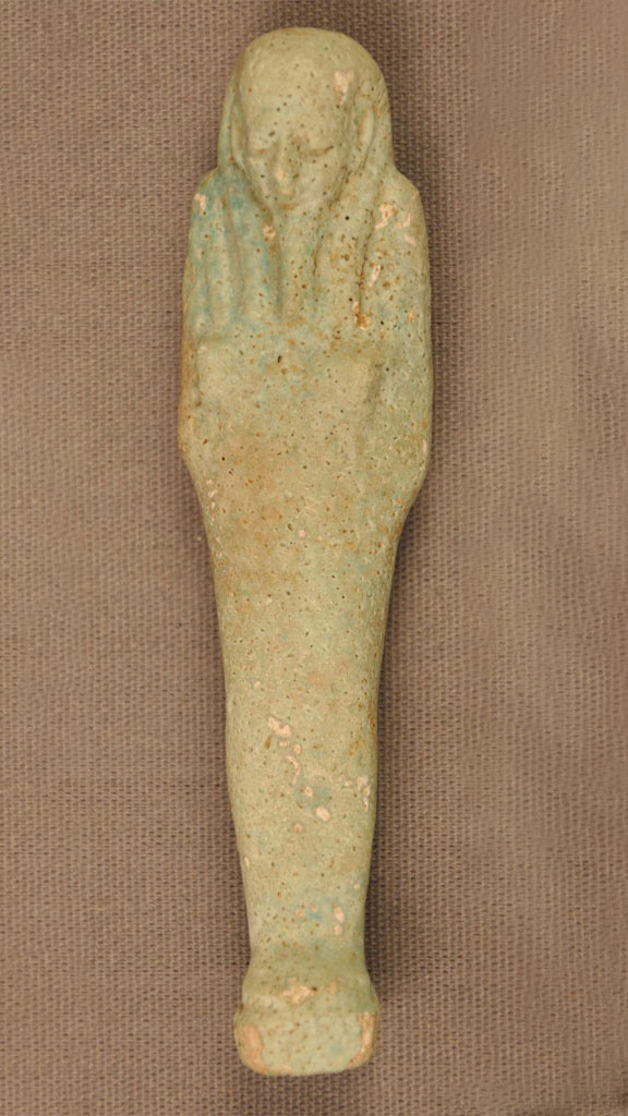 stone carving of a mummified human