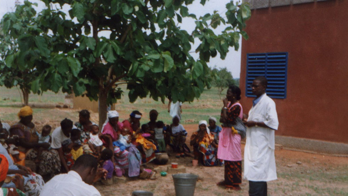 members of the village gathered to listen to a lecture