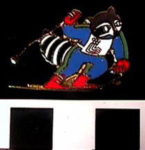 Thumbnail of Commemorative Olympic Pin:  Olympic Skiing Raccoon Mascot  (1980.09.0012C)