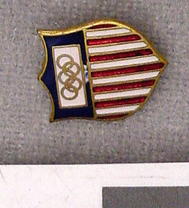 Thumbnail of Commemorative Olympic Pin: Official Emblem of the American Olympic Committee, Mounted on white paper stock (1977.01.1011R)
