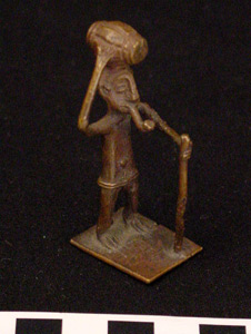 Thumbnail of Gold Weight Figure: Man with Powder Bag and Pipe (2003.10.0003)