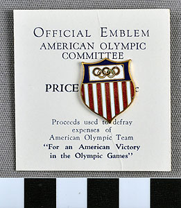 Thumbnail of Commemorative Olympic Pin: Official Emblem, Mounted on  white paper stock  (1977.01.1009T)