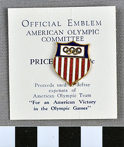 Thumbnail of Commemorative Olympic Pin: Official Emblem, Mounted on white paper stock (1977.01.1009U)