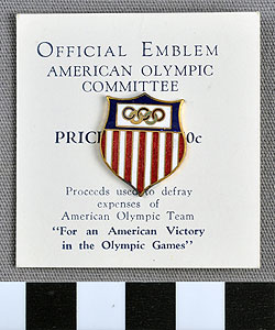 Thumbnail of Commemorative Olympic Pin: Official Emblem, Mounted on white paper stock  (1977.01.1009V)