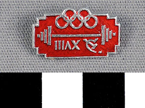 Thumbnail of Commemorative Pin for XVIII Summer Olympic Games in Tokyo worn by the Coaches, Trainers and Judges on the Soviet Olympic Team: Weight Lifting (1977.01.1340R)