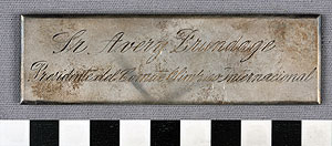 Thumbnail of Nameplate: "Sr. Avery Brundage / President del Comite Olimpico Internacional" (1977.01.1432)