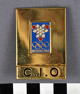 Thumbnail of Officials Badge, International Olympic Committee: X Winter Olympics (1977.01.1433A)