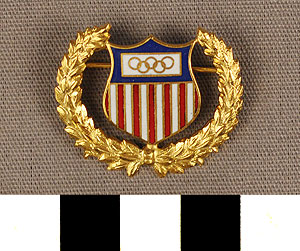 Thumbnail of Commemorative Olympic Pin: American Flag, 5 Rings, Laurel Wreath (1977.01.1008)