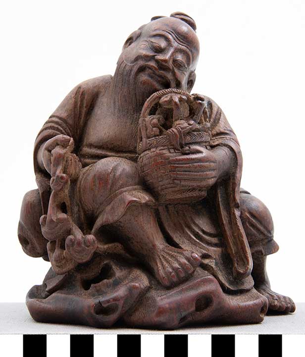 Thumbnail of Carving: Seated Monk with Basket of Lingzhi (2011.13.0001)