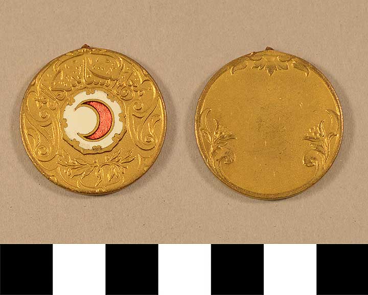 Thumbnail of Historic Medals: Ottoman Gilt-Inset Red Crescent in White (1971.15.2585)