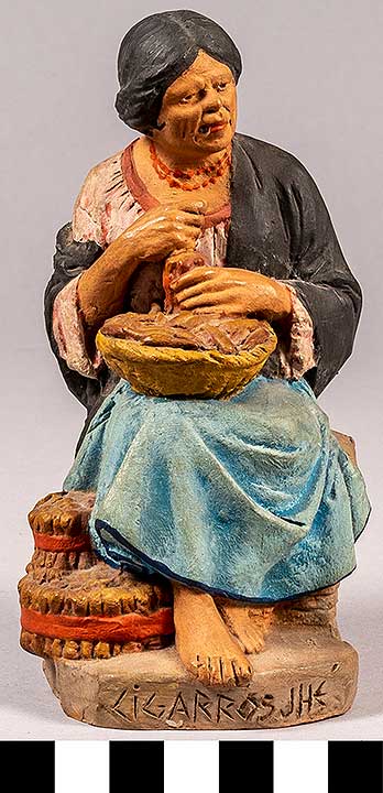 Thumbnail of Clay Figurine: Woman Sitting with Basket of Cigars, by Serafin Marsal  (2020.04.0008)
