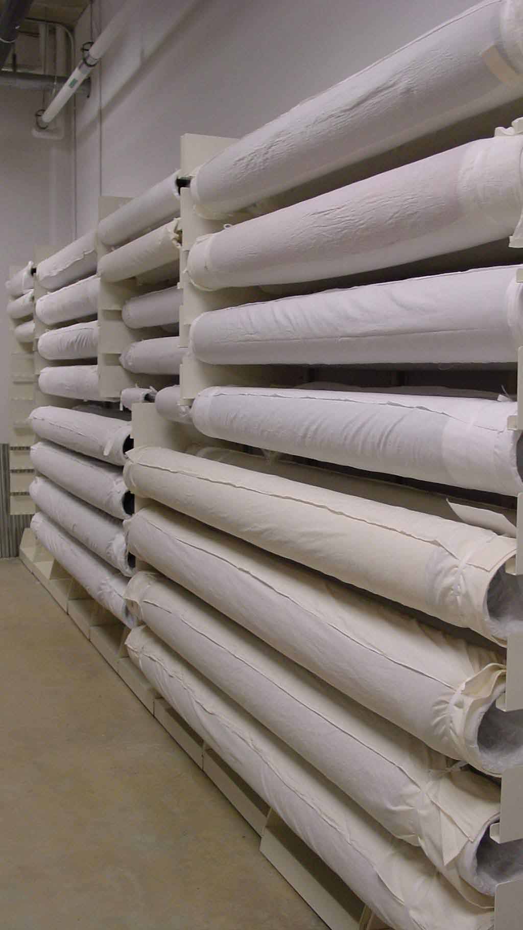 rolls of textiles on racks