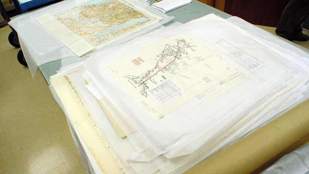 The maps await processing in the Spurlock Museum's workroom.