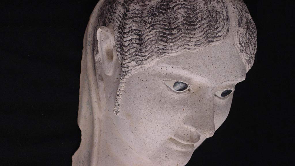 plaster burial mask of a woman, closer look, profile from an angle
