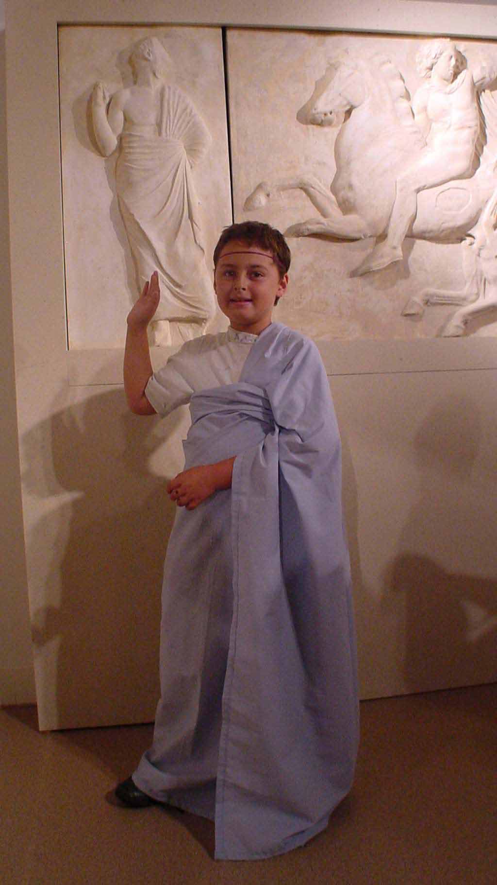 Boy in Greek-style outfit