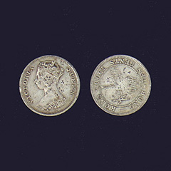 two adjacent images of silver tinted coins showing the top and bottom of coin