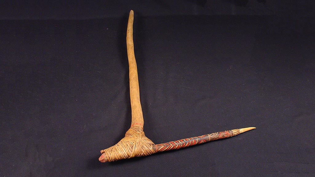 weapon made by latching two sticks together.  The one longer, smooth stick functioning as a handle with the other decorative, sharpened acting as a dagger