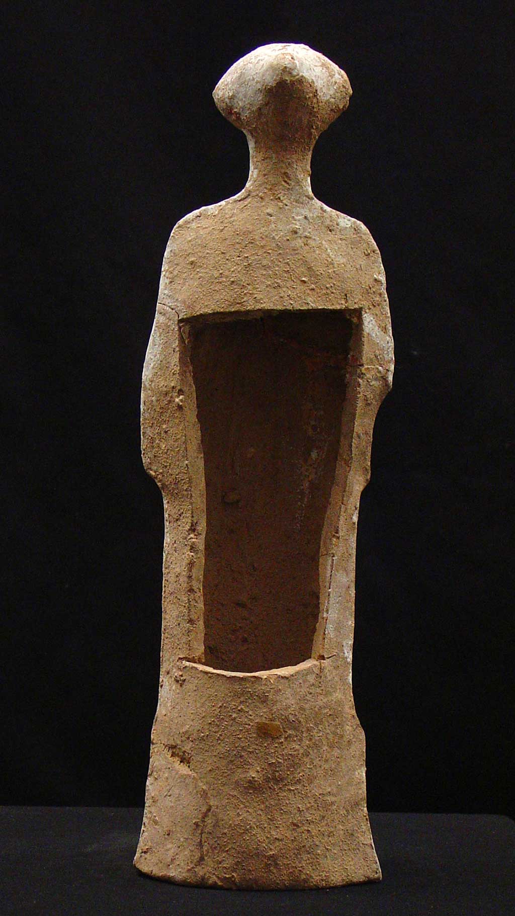 full back view of standing figure with a hole in the back