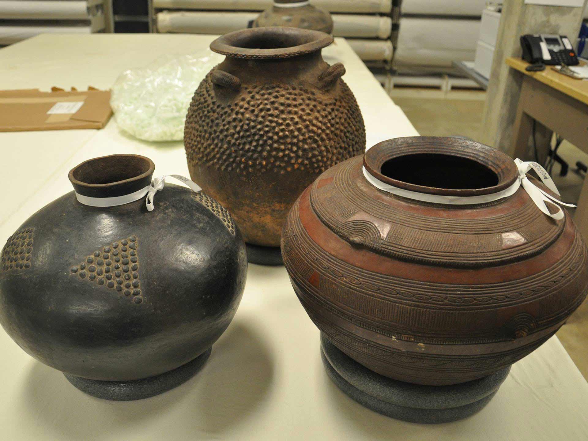 three large ceramic pot