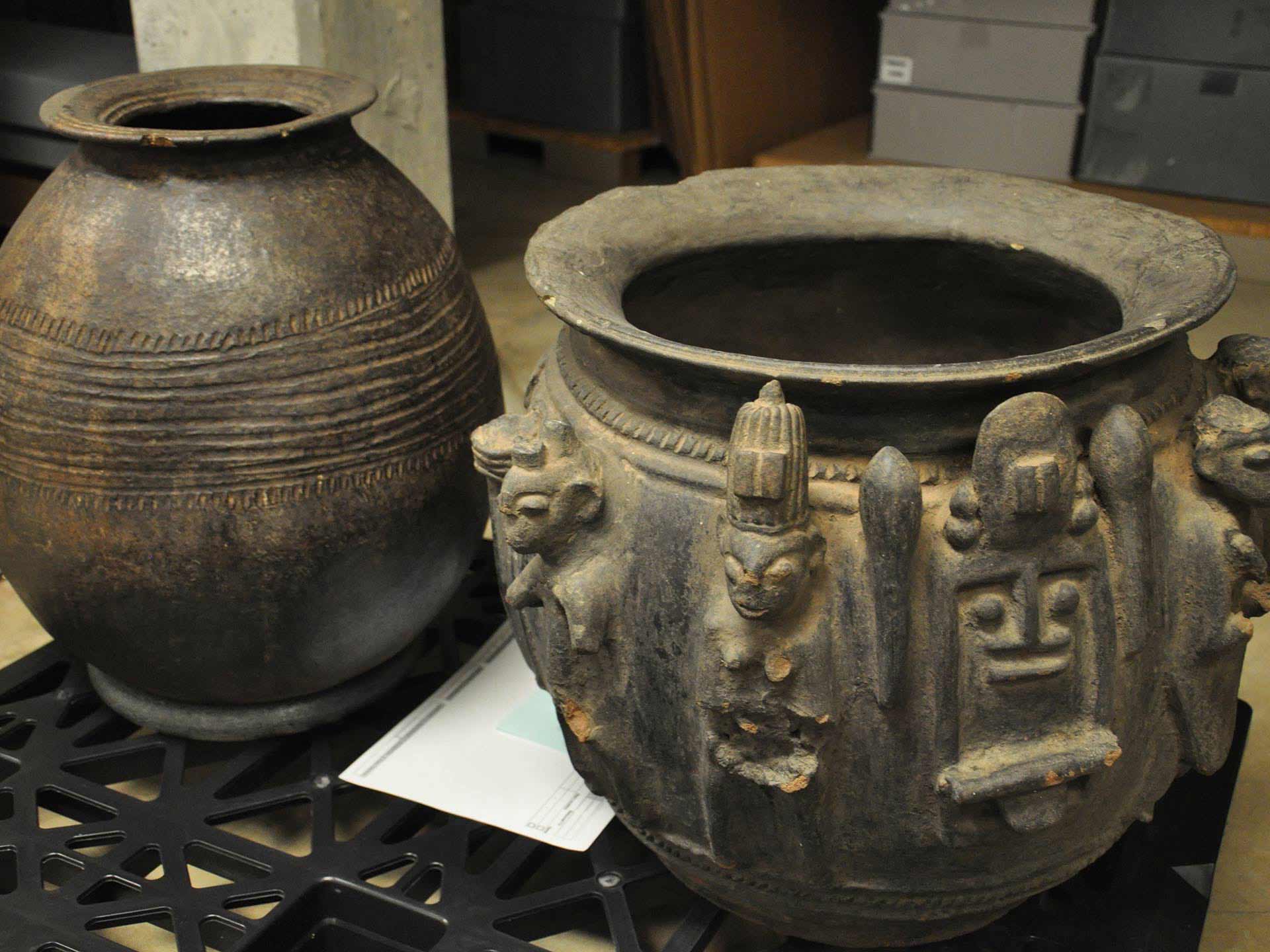 large ceramic pot with sculpted patterns and figures