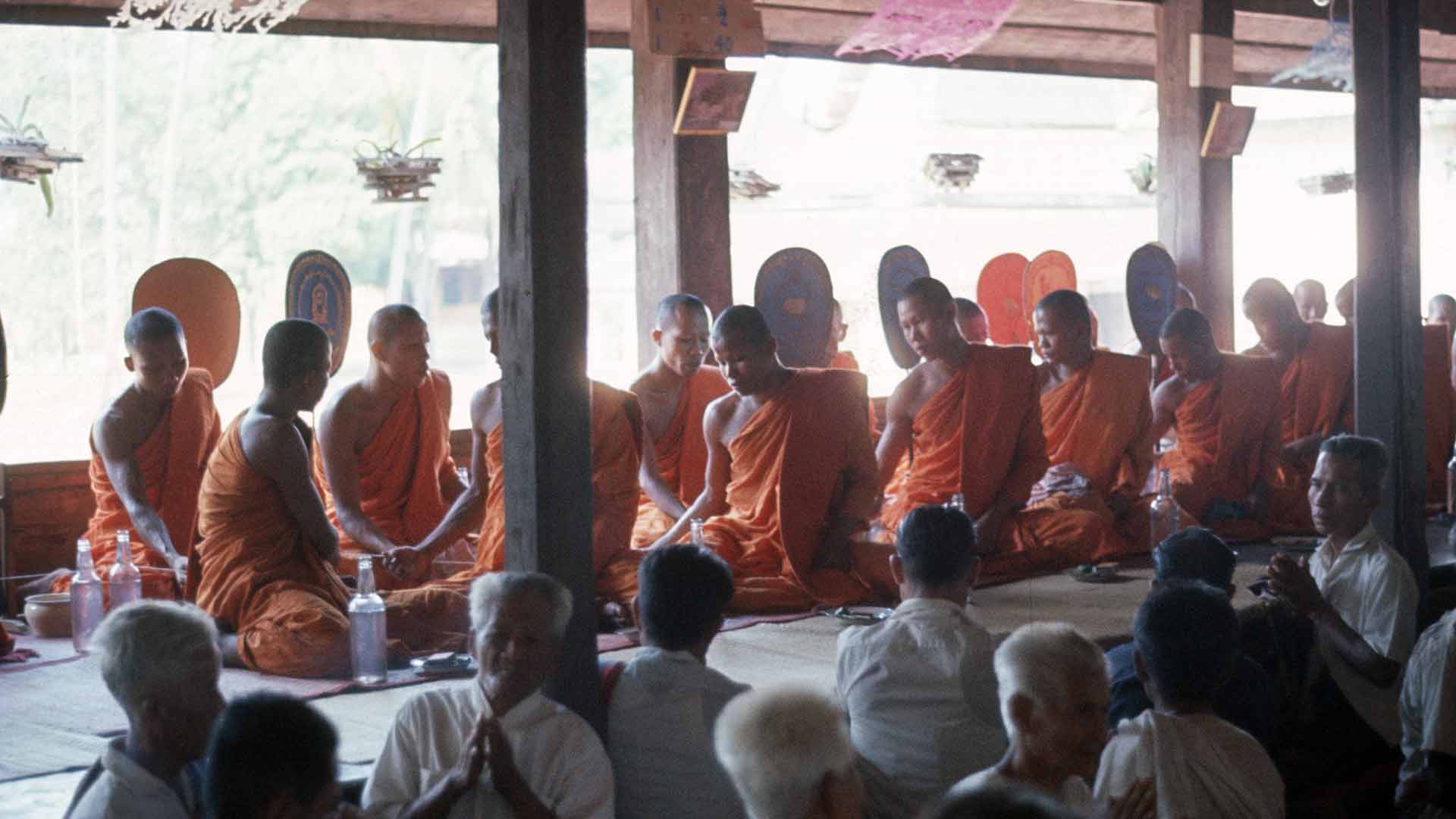 monks gather for meal, villagers separately dine