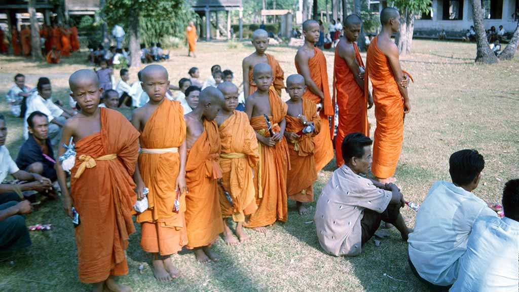 young monks lineup behind elders