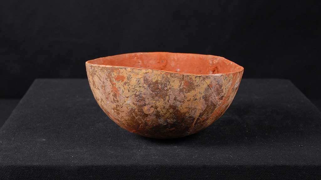 red earthen small simple utilitarian bowl