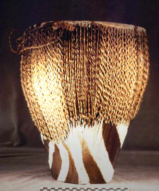 Weaved basket under warm light photographed in spot lighting 