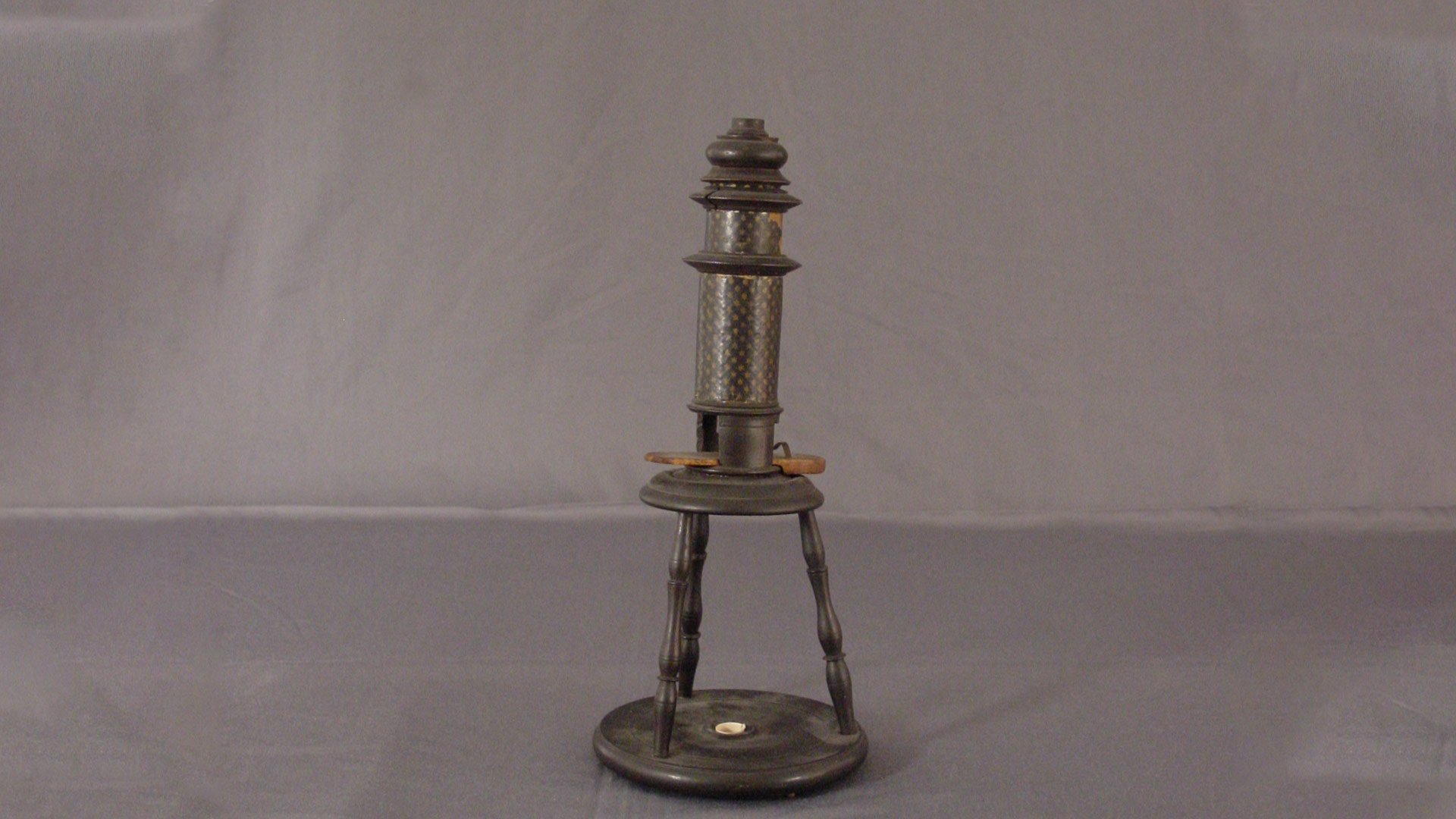 upright 17th century microscope using two lenses 