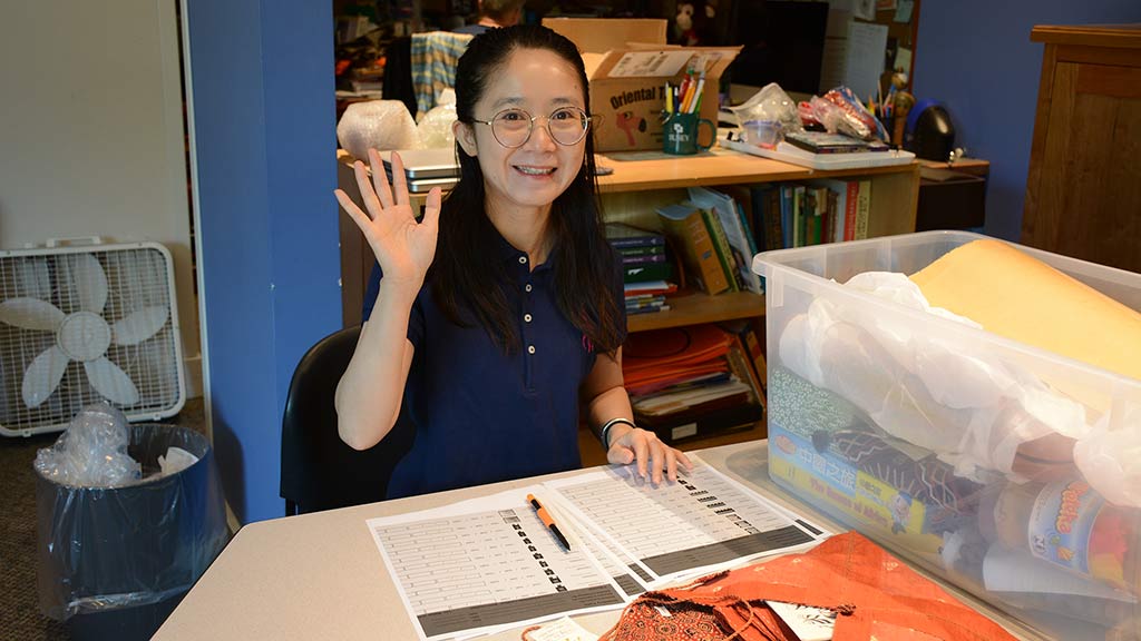 Shanshan Wei waving and smiling